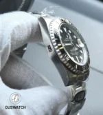 Side-profile shot that showcases the satin-brushed case flank and refined bezel edge on this Submariner.