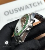 Close composition of the stainless steel case and screw-down crown showcasing machining and polish.