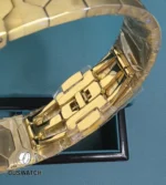 Interior view of the folding clasp construction demonstrating locking mechanics and stamped finishing marks.