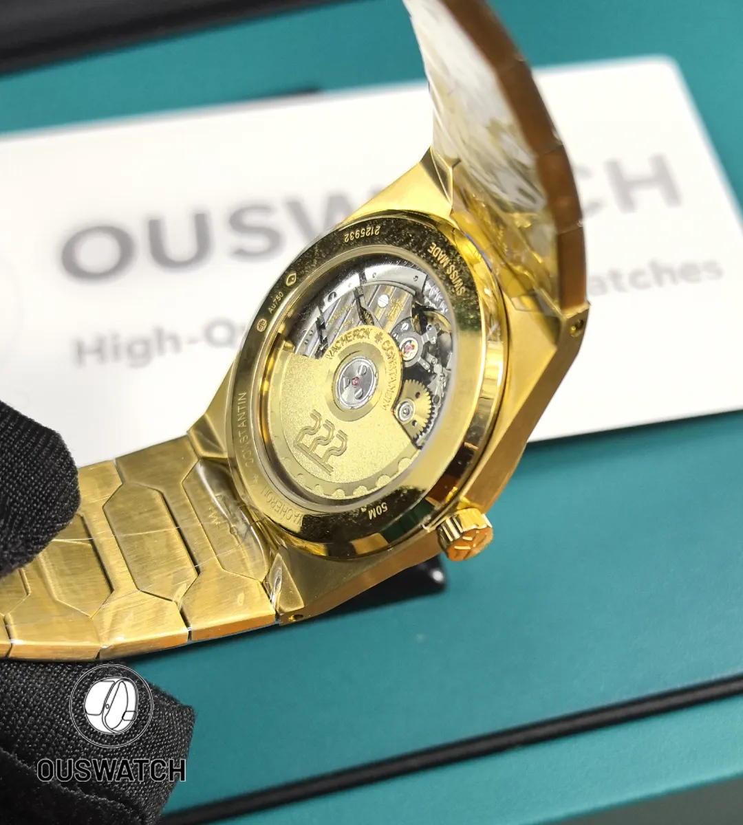 Macro of the movement area seen through the caseback, highlighting bridges, rotor finish and gear train.