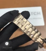 Full-length view of the rose-gold integrated bracelet, showing link profile and polished accents.