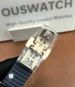 Rose gold folding clasp of the Aquanaut 5261R-001, engraved with Patek Philippe signature, attached to the textured blue rubber strap.