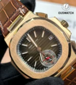 Patek Philippe Nautilus 5980R shown at a 45-degree angle, highlighting the rose gold case, octagonal bezel, and integrated brown leather strap.