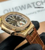 Side perspective of the Nautilus 5980R, displaying the rose gold lug, case profile, and the attachment of the brown leather strap.