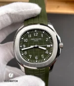 Extreme close-up of the Aquanaut green dial showing the embossed pattern, applied markers and fine surface texture.