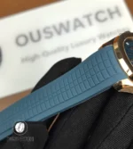 Textured blue rubber strap for the Aquanaut 5261R-001 laid flat to show grain, endlink fit and buckle junction.