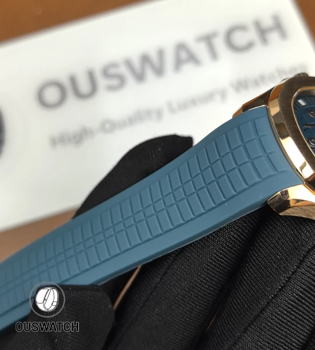 Textured blue rubber strap for the Aquanaut 5261R-001 laid flat to show grain, endlink fit and buckle junction.