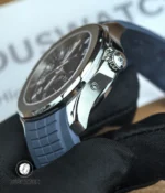 Tight shot of the case and signed crown on the Aquanaut Travel Time, showing knurling and polished bevels.