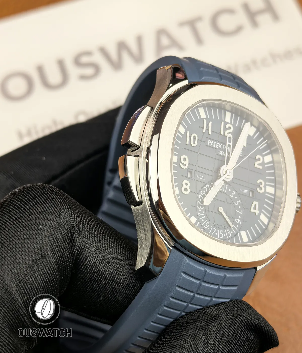 Close view of the Aquanaut Travel Time side pushers used for quick dual-time adjustments.