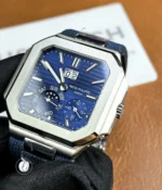 Close composition of the blue dial and satin-finished bezel area, highlighting texture contrasts and brushing.