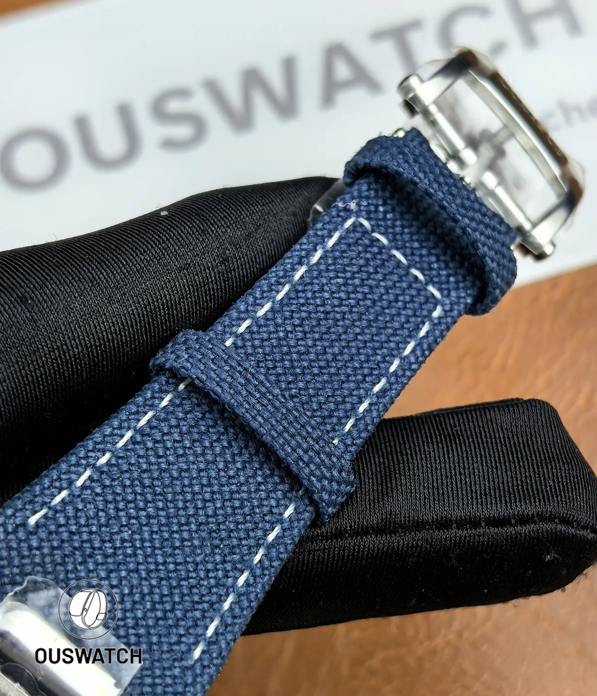 Composite material strap for the 5822P shown flat to display texture, stitching and endlink fitment.