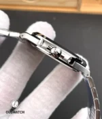 Close-up of the case flank and signed crown on the Nautilus 5711, showing knurling and seamless crown tube join.