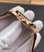 Macro close-up of the signed crown on the Nautilus 5712, showing knurling, crown tube and polished chamfers.