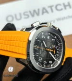 Macro view of the Patek Philippe Aquanaut Chronograph 5968A-001 rubber strap connection, showcasing the perfect integration between the composite strap and the polished steel case.