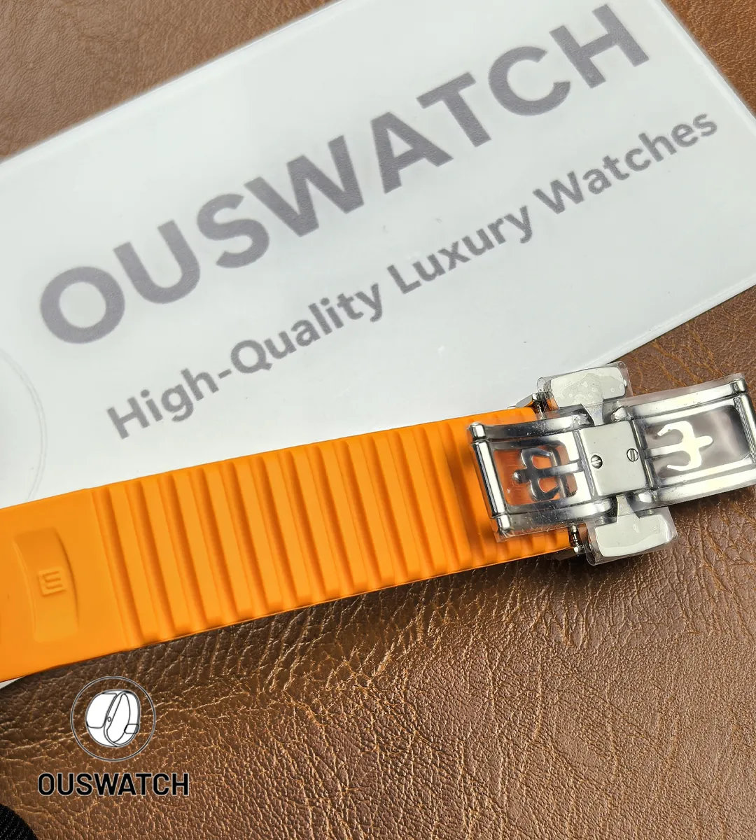 Close-up of the orange rubber strap of the Patek Philippe Aquanaut Chronograph 5968A-001, showing the embossed grid texture and supple yet durable material quality.