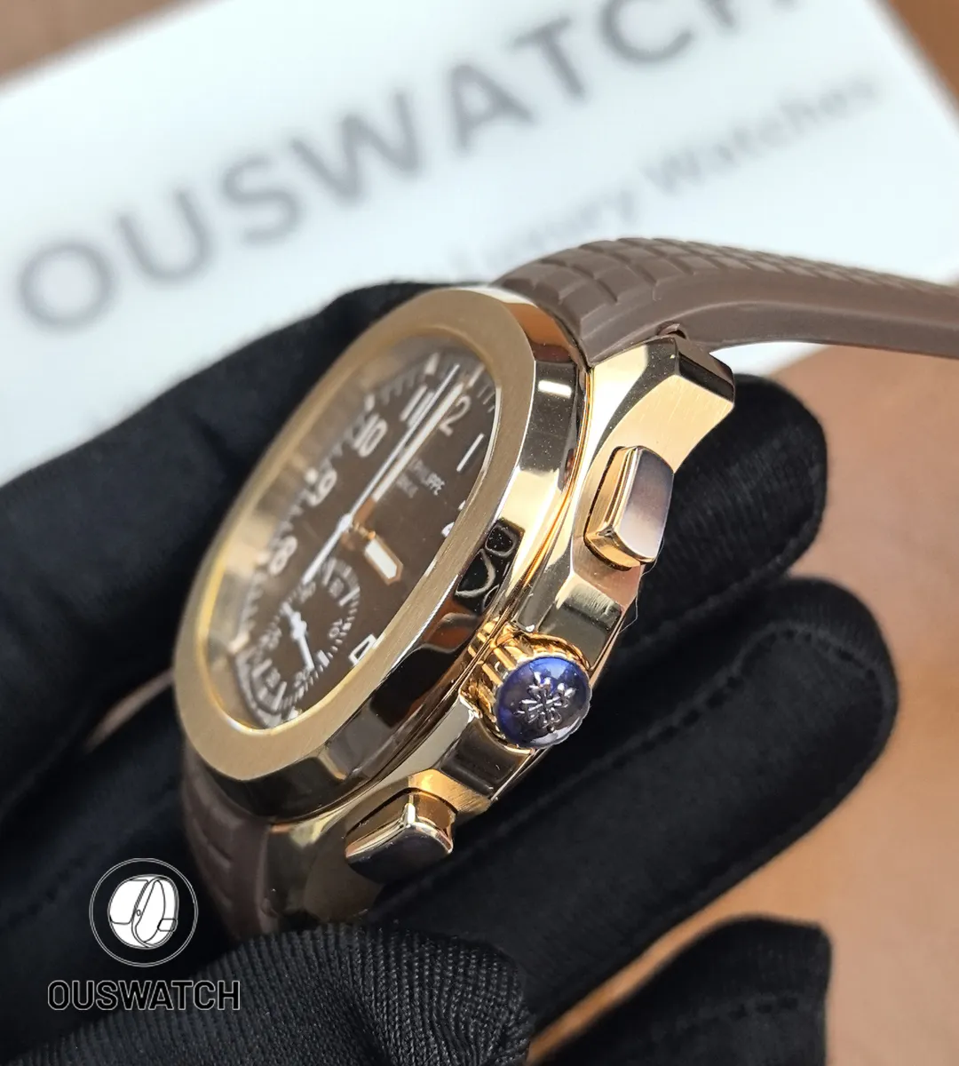 Side profile of the Patek Philippe Aquanaut Chronograph 5968R-001 crown side, displaying the chronograph pushers, fluted crown, and polished case contours.