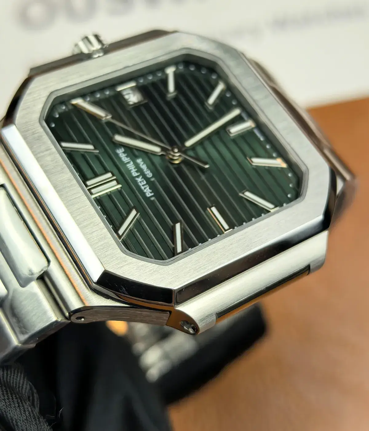 Close-up of Patek Philippe Cubitus 5821-1A-001 stainless steel bezel with polished and brushed finishing contrast