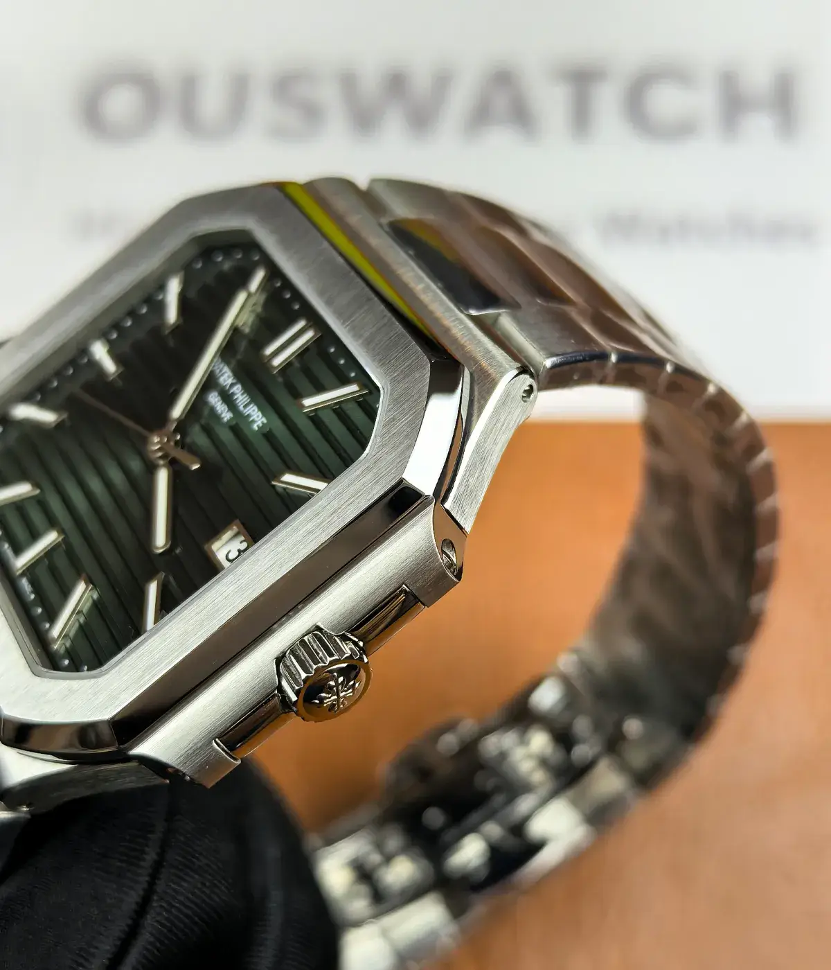 Detailed crown view of Patek Philippe Cubitus 5821-1A-001 45mm stainless steel super clone watch with engraved logo