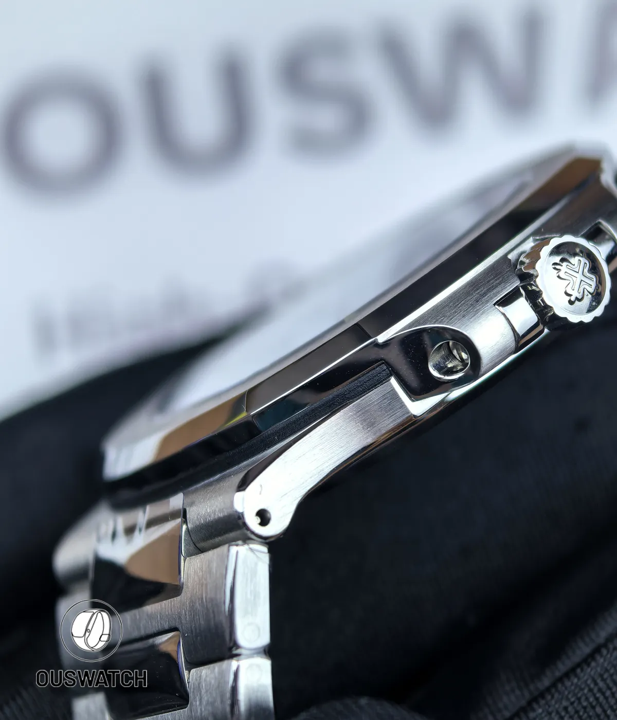 Macro shot of the connection between the case and bracelet on the Patek Philippe Nautilus 5711/1A-018 Tiffany & Co, reflecting the seamless engineering of integrated bracelet design.