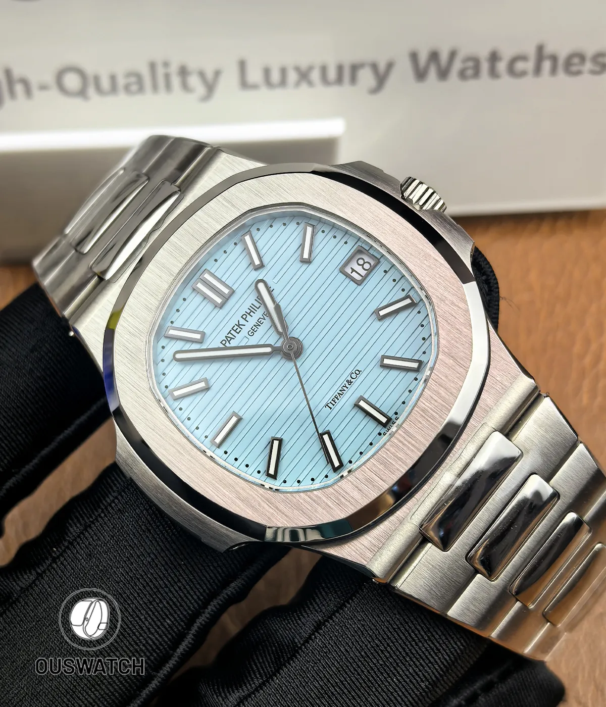 Patek Philippe Nautilus 5711/1A-018 Tiffany & Co at a 45-degree left angle, displaying the harmonious case curvature and vibrant Tiffany blue dial under natural light.