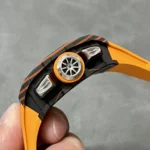 Side profile showing the Carbon TPT case and signed crown of the RM 11-03 McLaren, emphasizing composite layers and crown knurling.