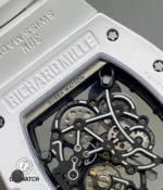 Detailed rear composition featuring the RM055 caseback logo and visible movement decoration under the crystal.