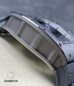 Detail shot showing the grey ceramic bezel mated to the titanium case on the RM 055, highlighting material contrast and finishing.