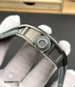 Macro close-up of the RM 055 crown showing knurling, protective crown shoulders and precision machining detail.