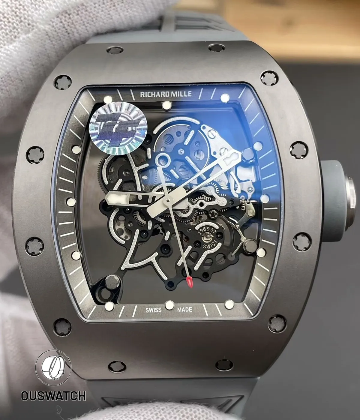 Front-facing shot of the RM 055 in grey ceramic revealing the skeletonized dial, bold hands and bezel profile.