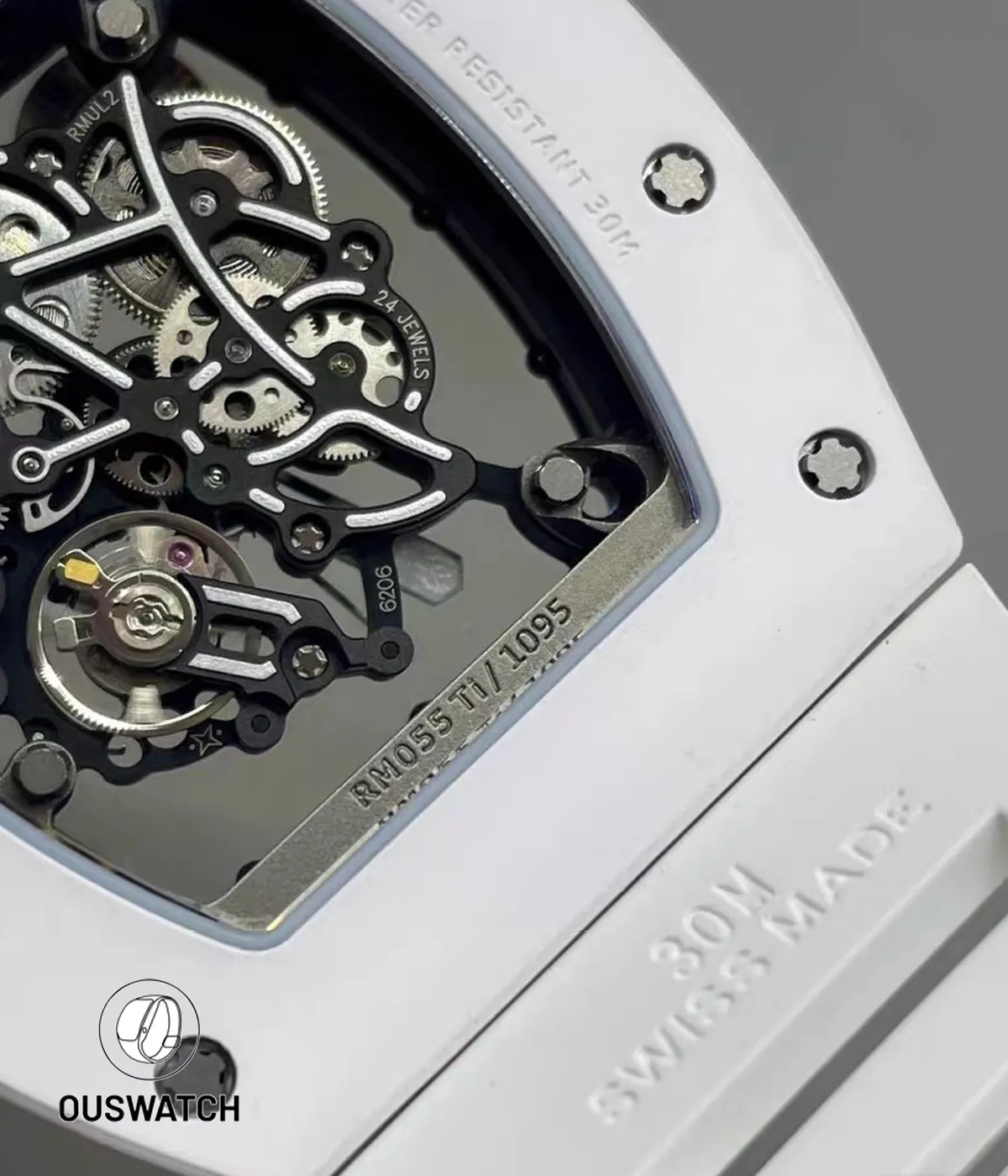 Tight close-up of the RM055 skeleton movement highlighting polished edges, screw heads and micro-finish textures.