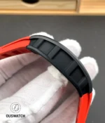 Side case view of the RM 055 red edition showing the satin finish and ergonomic curvature of the case body.