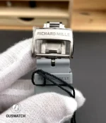 Close detail of the stainless-steel clasp for the RM 055, illustrating hinge engineering and stamped branding.