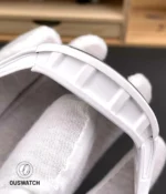 Side composition highlighting the white ceramic case profile of the RM055, showing matte texture and caseband contour.