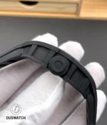 Close-up of the signed crown on the RM 055 White Legend showing knurling and crown-tube detail.