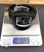 Weight measurement of the RM 055 White Legend displayed on a precision scale to show carry weight.