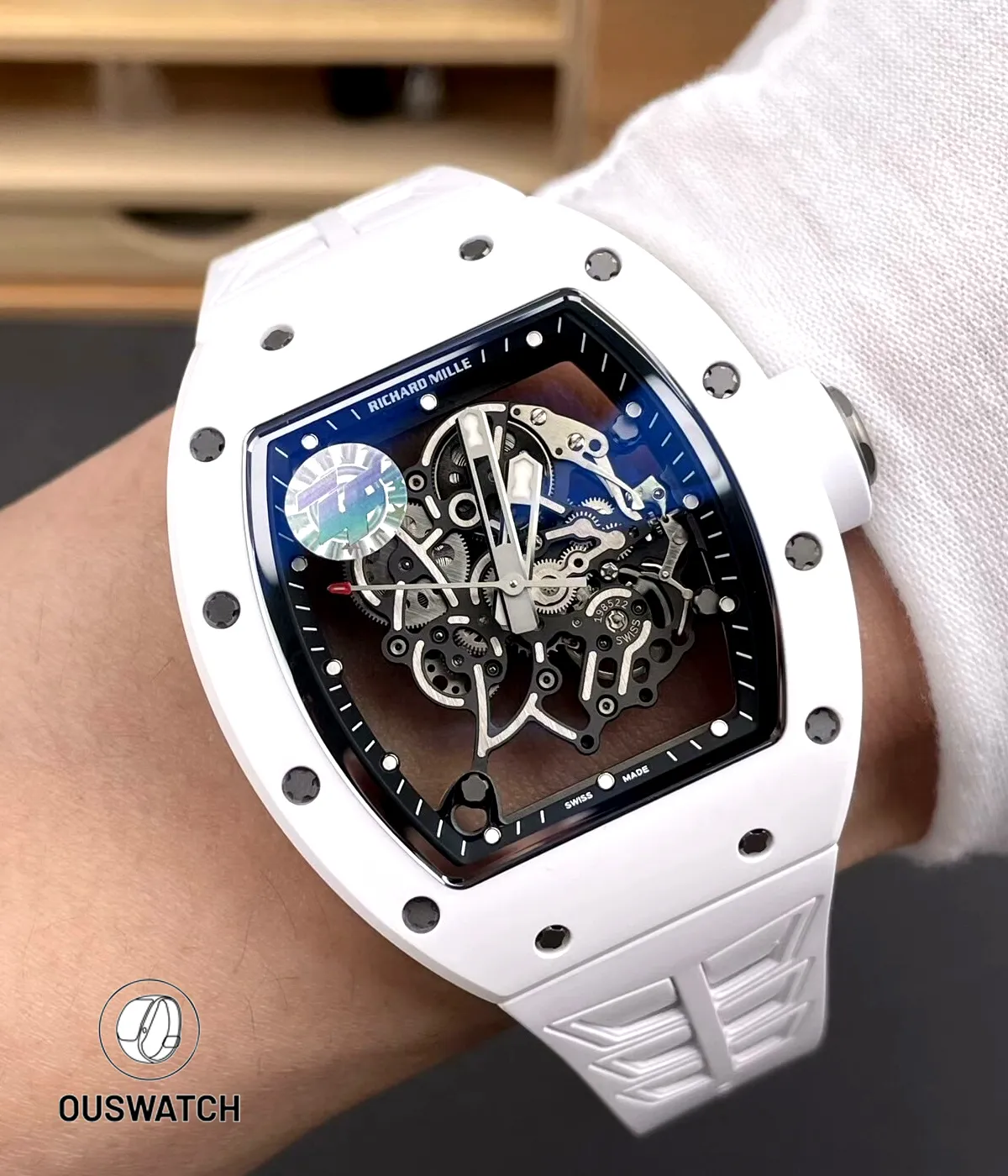 On-wrist shot of the RM055 Bubba Watson in white ceramic illustrating scale, wrist fit and sporty elegance.