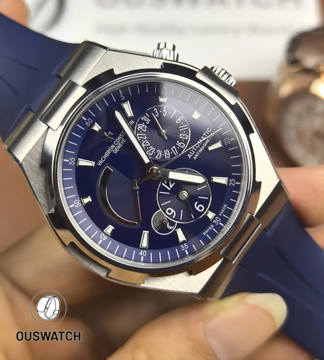 120° dial-focused shot revealing layered hands, subtle sunburst effects and the secondary timezone scale.