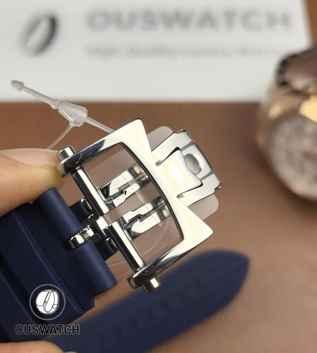 Macro of the clasp interior displaying stamped hallmarks, hinge engineering and micro-adjust slots