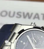 Macro study of the Overseas stainless-steel case showing brushed surfaces, polished bevels and machining texture.