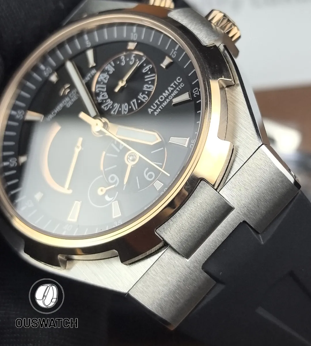 Tight macro of the case-to-lug junction on the 47450 two-tone, showing precise link fitment and chamfer detail.