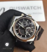 Macro of the dual-time dial showing the secondary time indicator, applied indices and subtle dial grain.