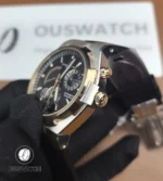 Tight shot of the rose-gold bezel and crown area revealing the warm gold tone against brushed steel surfaces.