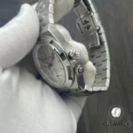 Macro detail of the case-to-crown area on the 7900V, revealing knurling, crown tube and fine machining.