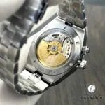 Detailed view of the movement area through the caseback, highlighting bridge finishing and rotor decoration.