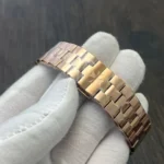 Full-length view of the rose-gold bracelet, highlighting link geometry and polished-to-brushed contrast.