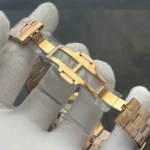 Fully unfolded rose-gold folding clasp showing stamped hallmarks and the clasp’s locking mechanism.