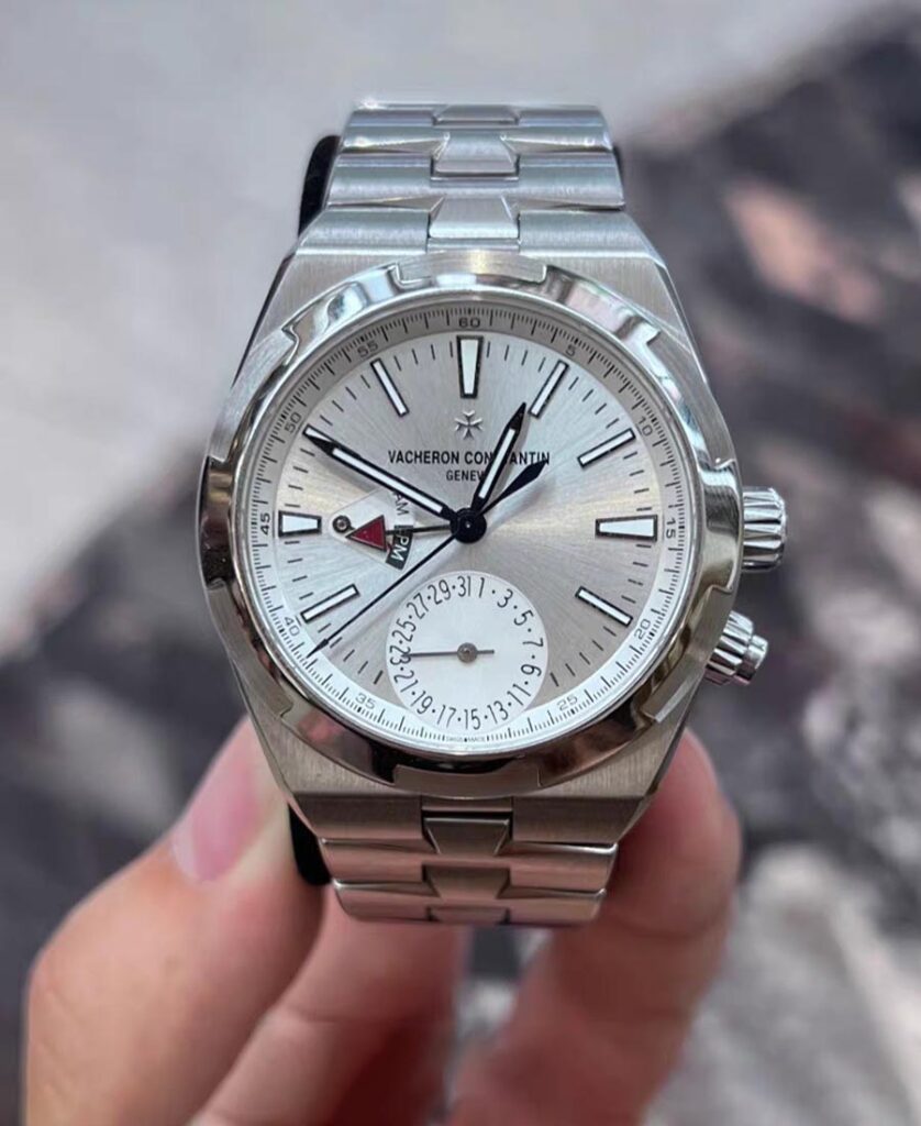 Vacheron OAverseas Dual Time 7900V/110A-B333 stainless steel replica — straight-on portrait showing the dual-time layout and clean silver dial.