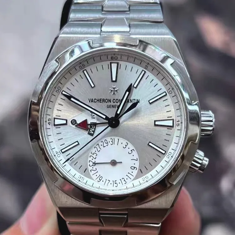 Vacheron Overseas Dual Time 7900V/110A-B333 stainless steel replica — straight-on portrait showing the dual-time layout and clean silver dial.