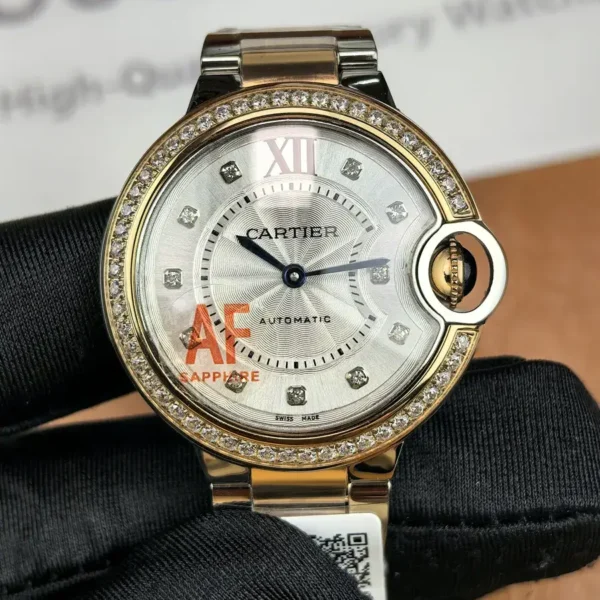 Front view of Cartier Iced Out Ballon Bleu 33mm ladies watch with diamond-set bezel and silver dial.