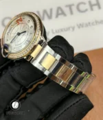 Two-tone stainless steel and rose gold bracelet of the Cartier Iced Out Ballon Bleu 33mm ladies watch, full-length view.